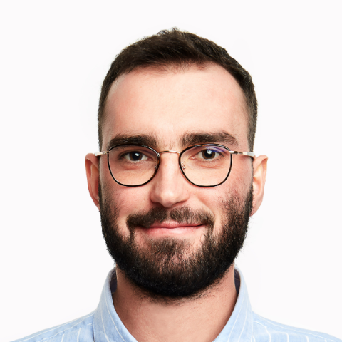 Pixel-art portrait of Tomek